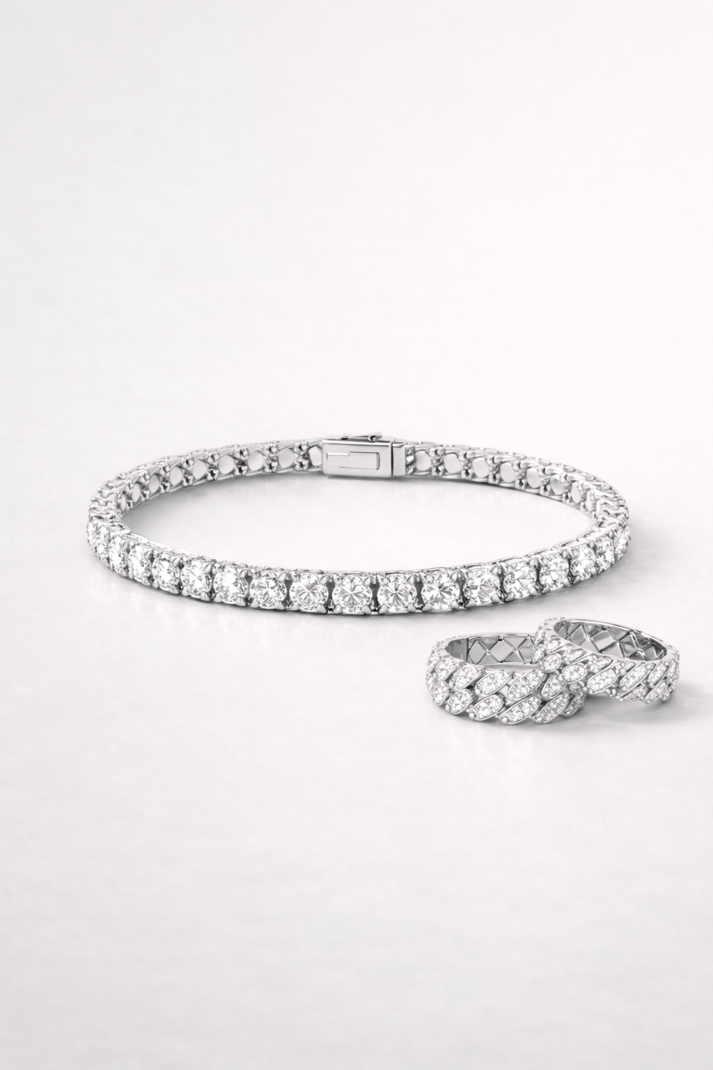 Diamond bracelet and ring on a white background